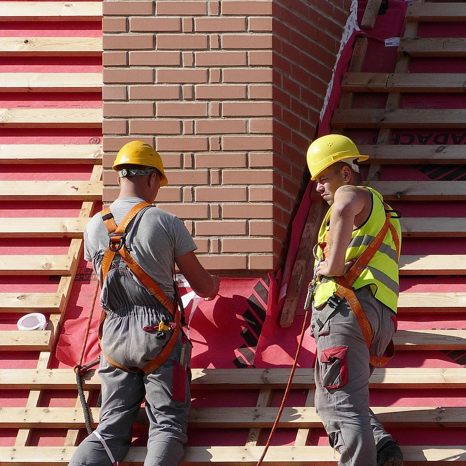 construction team meeting with hard hats